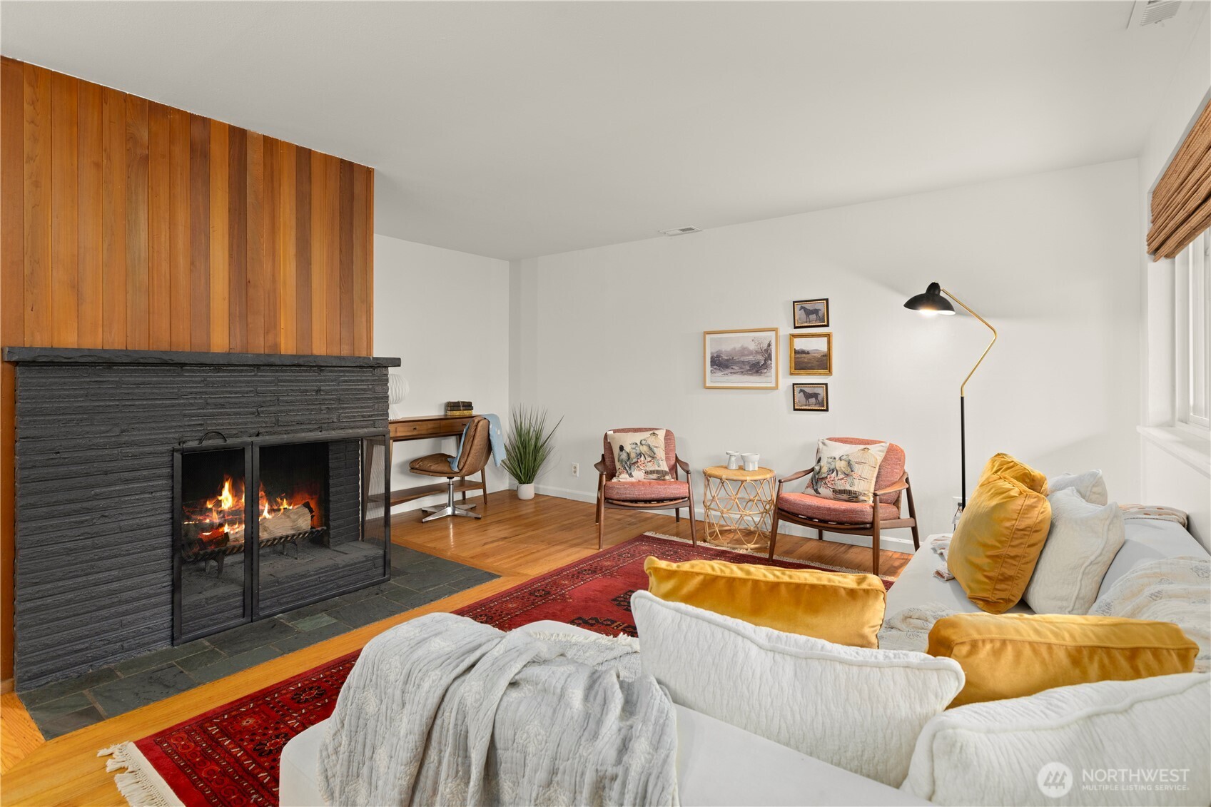 1259 North 173rd Street Shoreline, WA 98133 - Photo 6 of 37 a living room with furniture and a fireplace