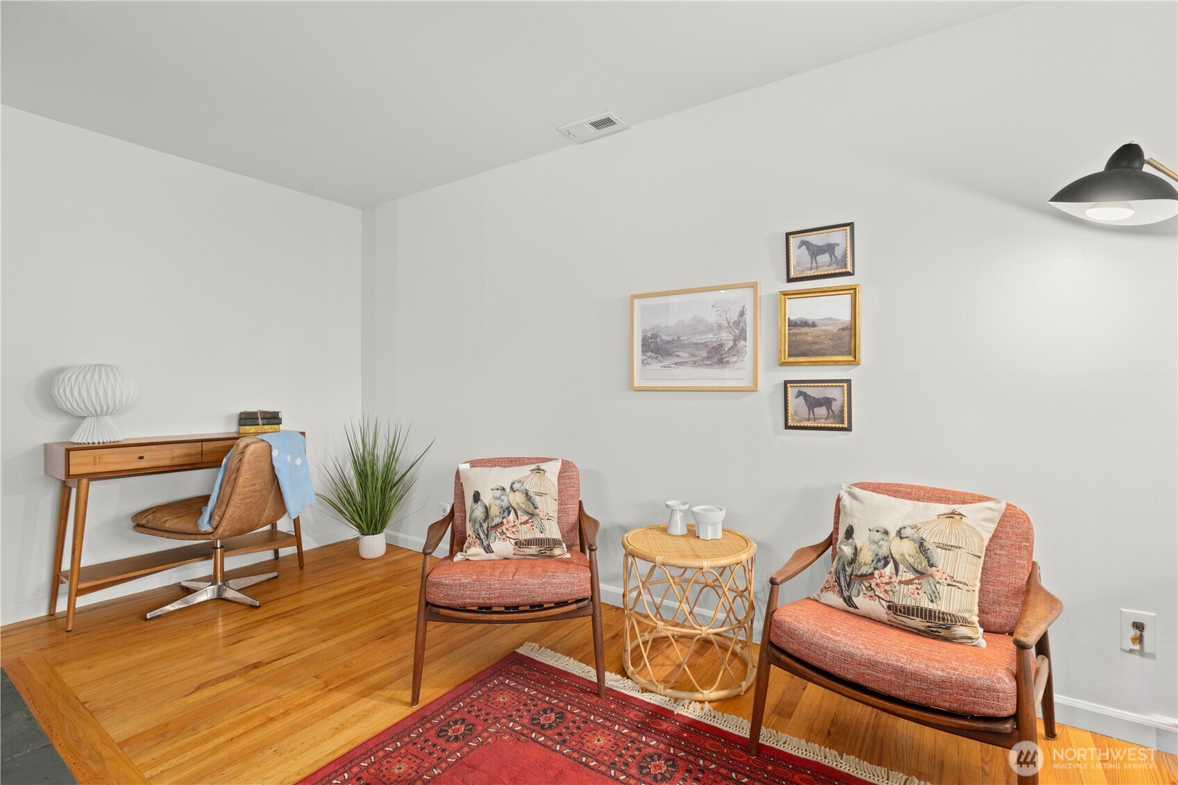 1259 North 173rd Street Shoreline, WA 98133 - Photo 8 of 37 a living room with furniture and a wooden floor