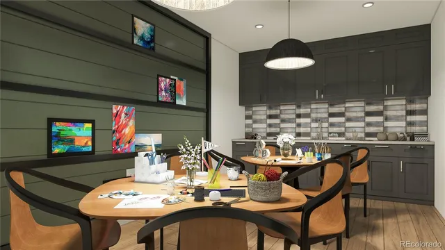 a dining room with furniture and a flat screen tv