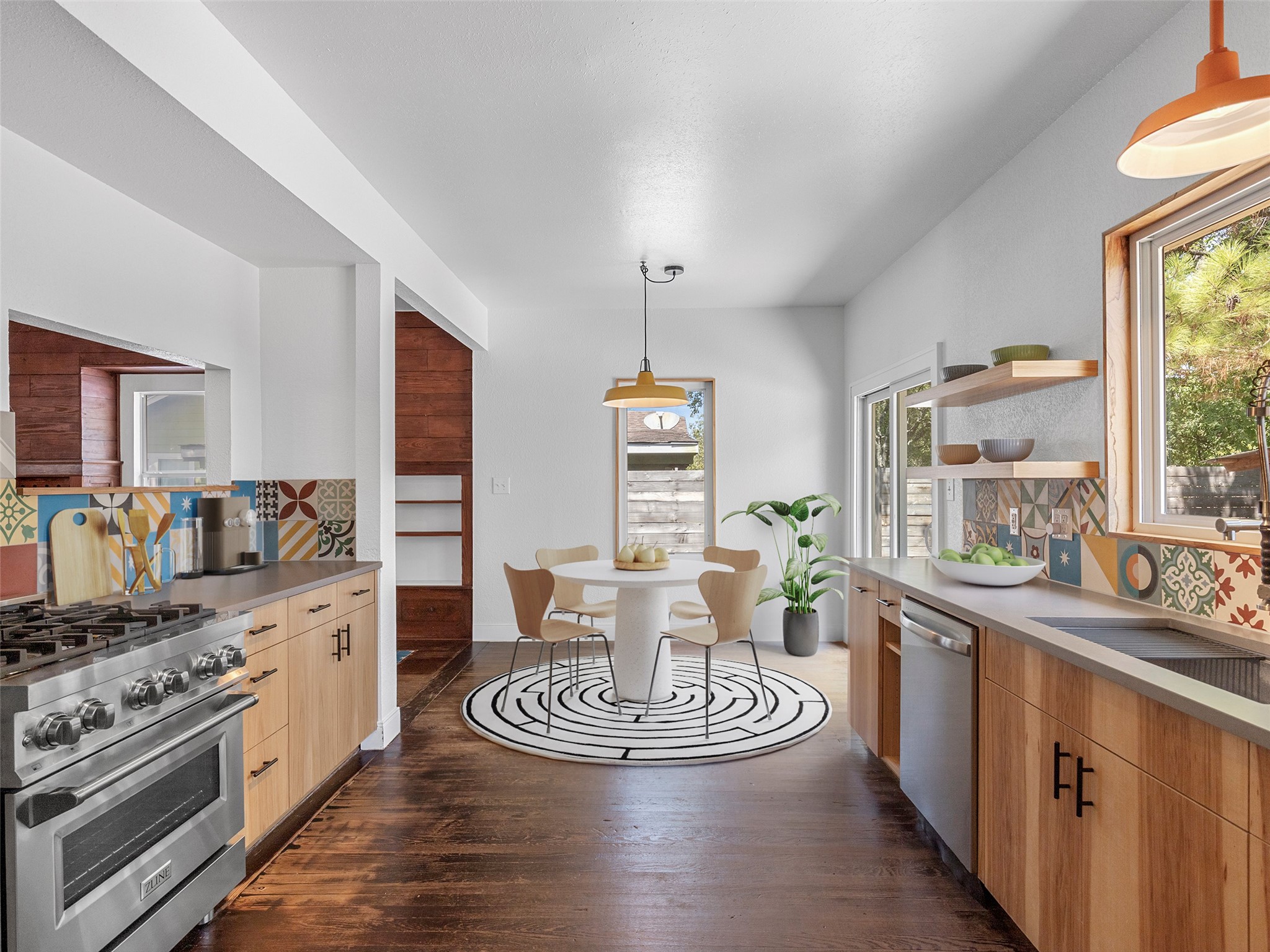 1809 Wilson Street Bastrop, TX 78602 - Photo 15 of 40 a kitchen with a table chairs stove and cabinets