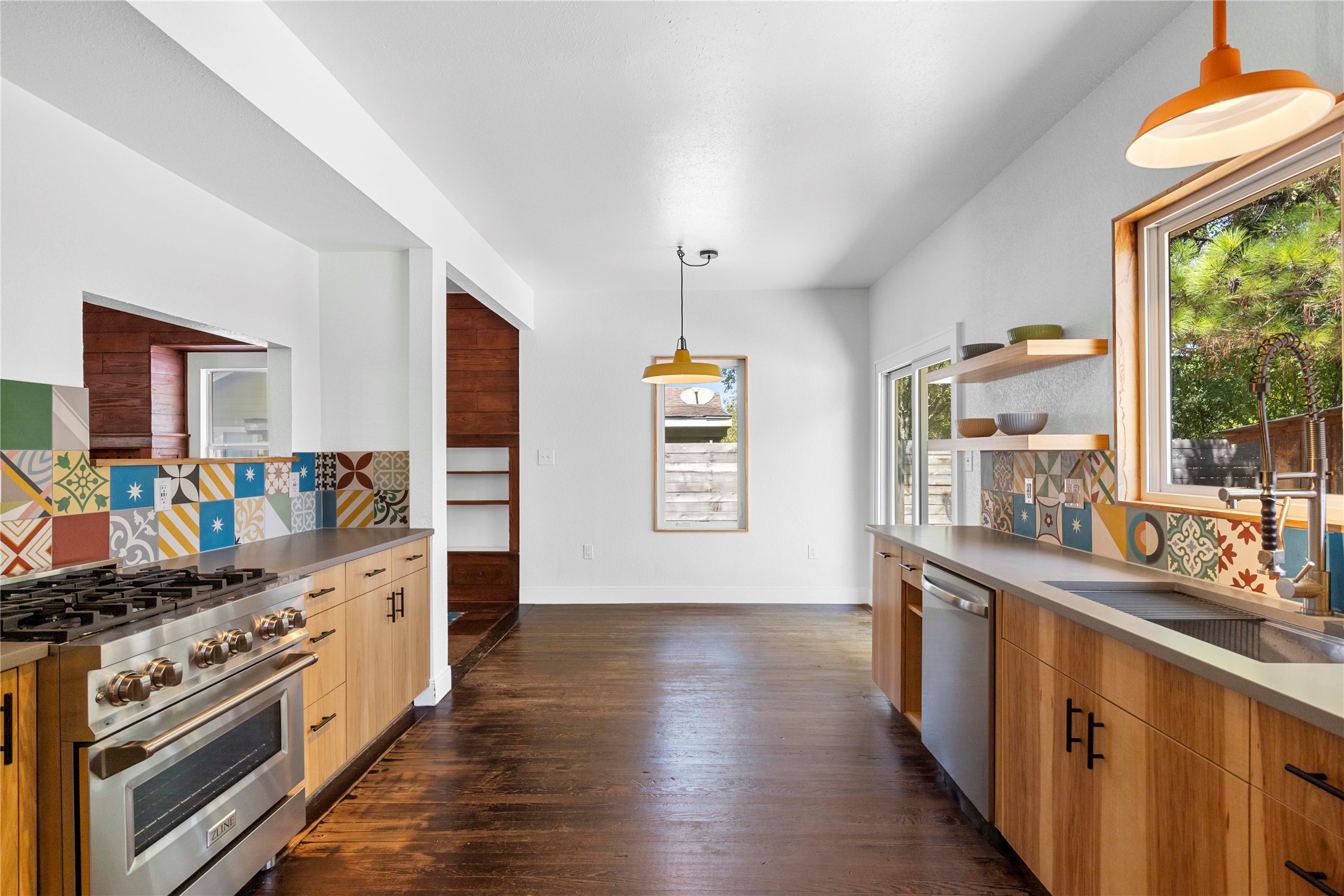 1809 Wilson Street Bastrop, TX 78602 - Photo 16 of 40 a kitchen with stainless steel appliances a stove top oven and sink