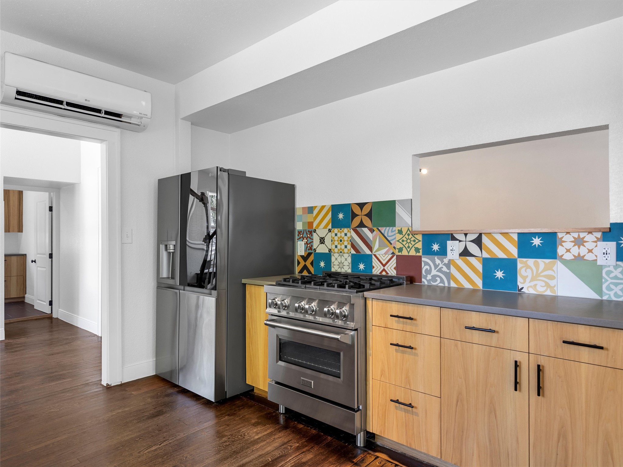1809 Wilson Street Bastrop, TX 78602 - Photo 17 of 40 a kitchen with stainless steel appliances a refrigerator and a stove