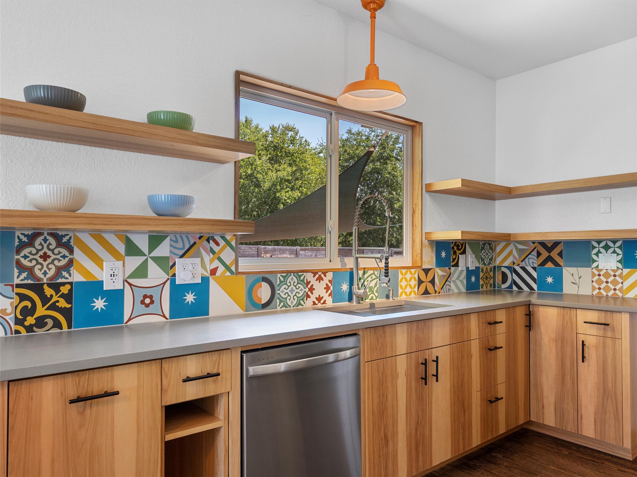 1809 Wilson Street Bastrop, TX 78602 - Photo 19 of 40 a kitchen with stainless steel appliances a sink and a window