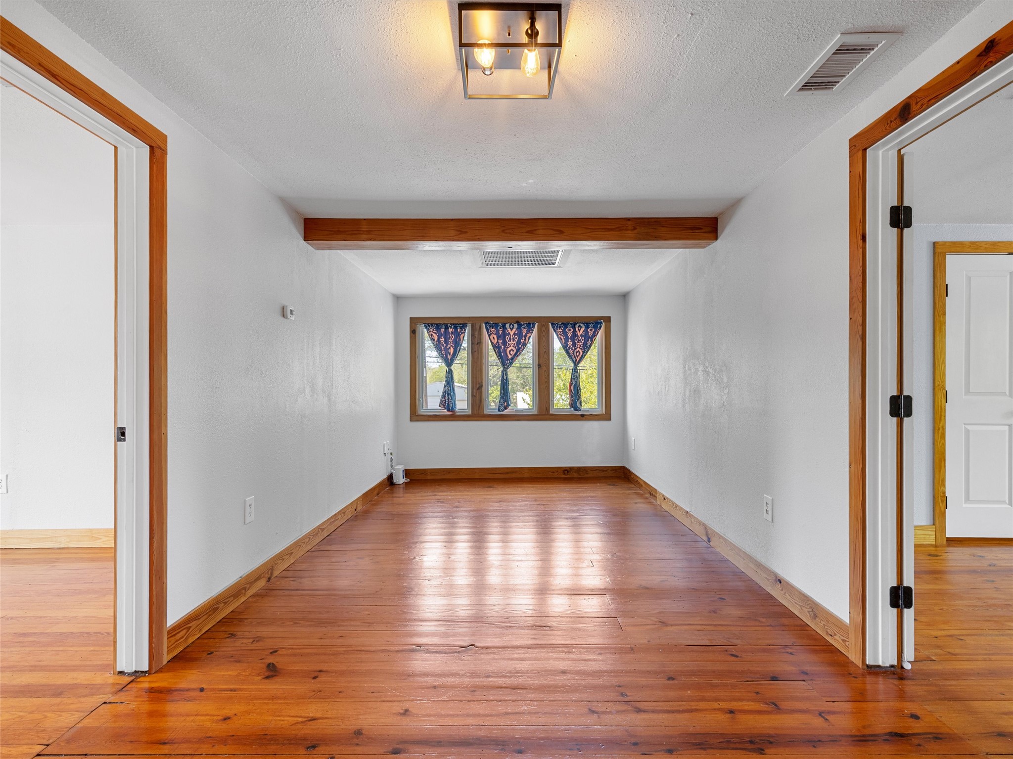 1809 Wilson Street Bastrop, TX 78602 - Photo 22 of 40 a view of an empty room and window