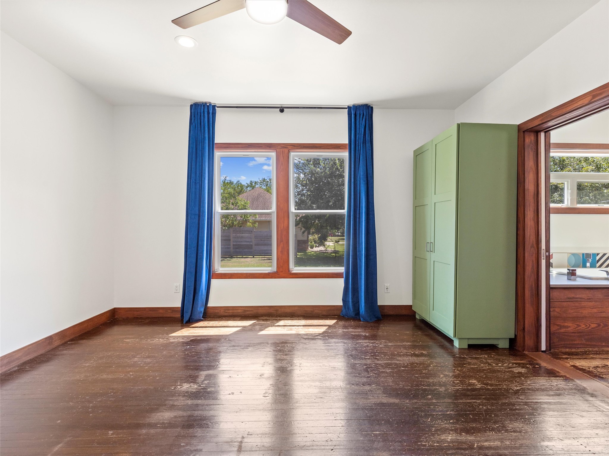 1809 Wilson Street Bastrop, TX 78602 - Photo 25 of 40 an empty room with wooden floor and windows