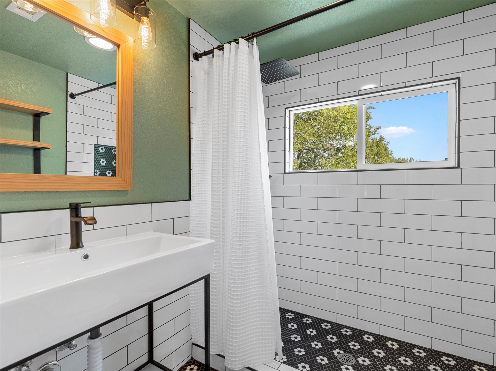 1809 Wilson Street Bastrop, TX 78602 - Photo 31 of 40 a bathroom with a sink and a mirror