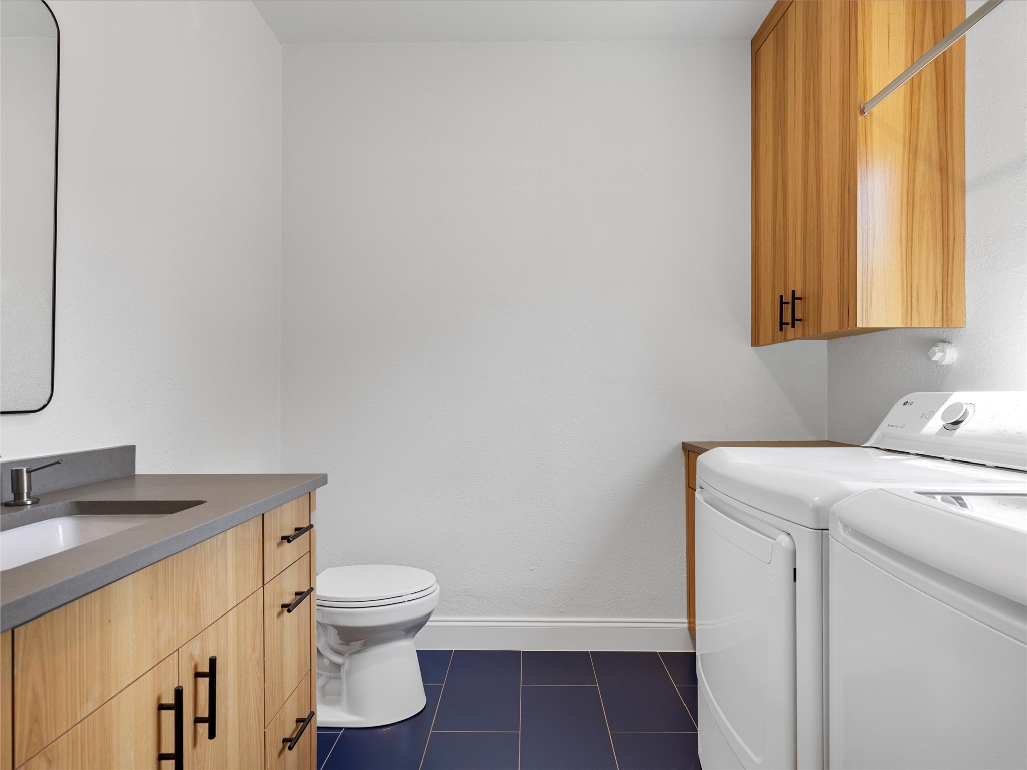 1809 Wilson Street Bastrop, TX 78602 - Photo 35 of 40 a bathroom with a sink toilet and window