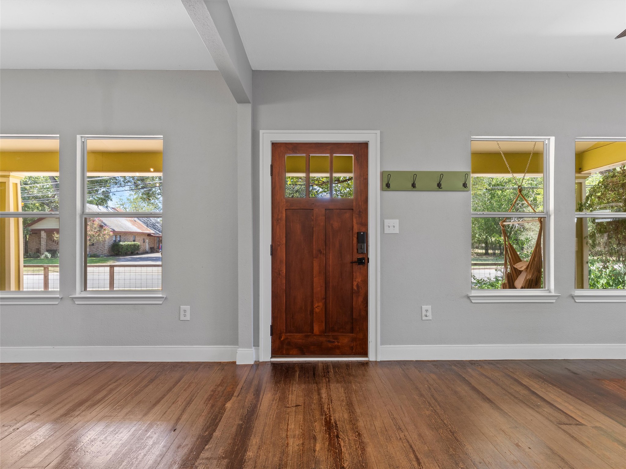 1809 Wilson Street Bastrop, TX 78602 - Photo 4 of 40 an empty room with wooden floor and windows
