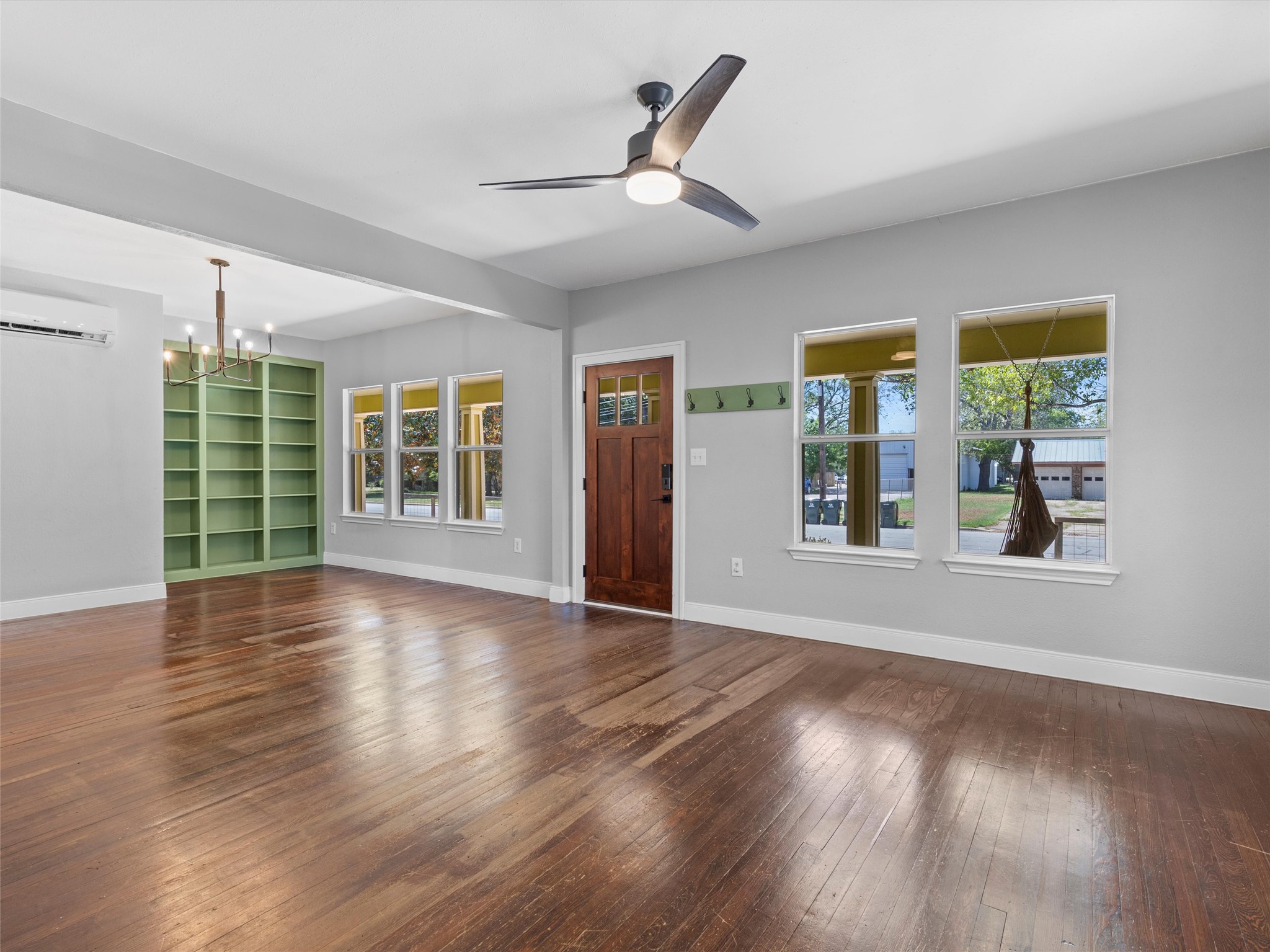 1809 Wilson Street Bastrop, TX 78602 - Photo 7 of 40 a view of an empty room with wooden floor and a window