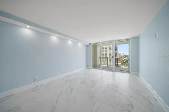 a view of an empty room with a window