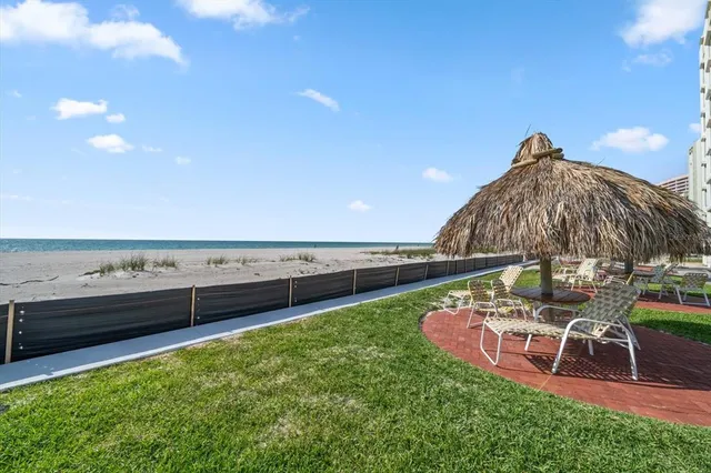 a view of a terrace with a table and chairs