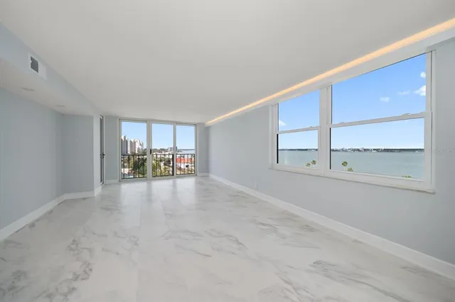 a view of an empty room with a window