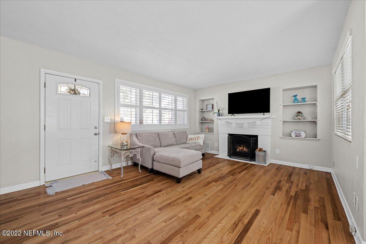 6115 Duke Road Jacksonville, FL 32217 - Photo 5 of 24 a living room with furniture and a fireplace