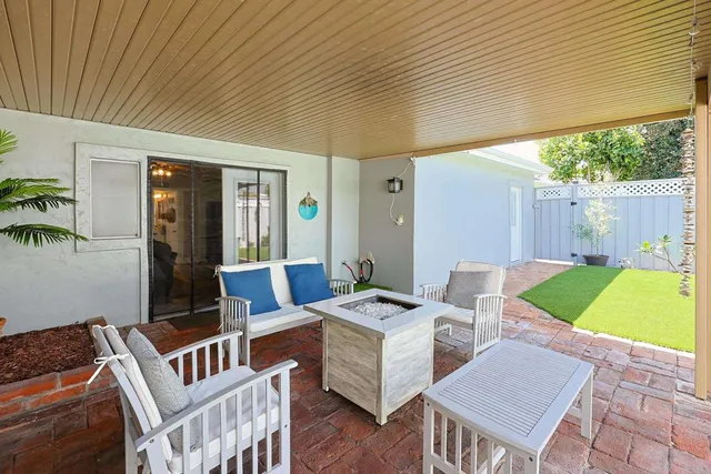 a backyard of a house with seating space