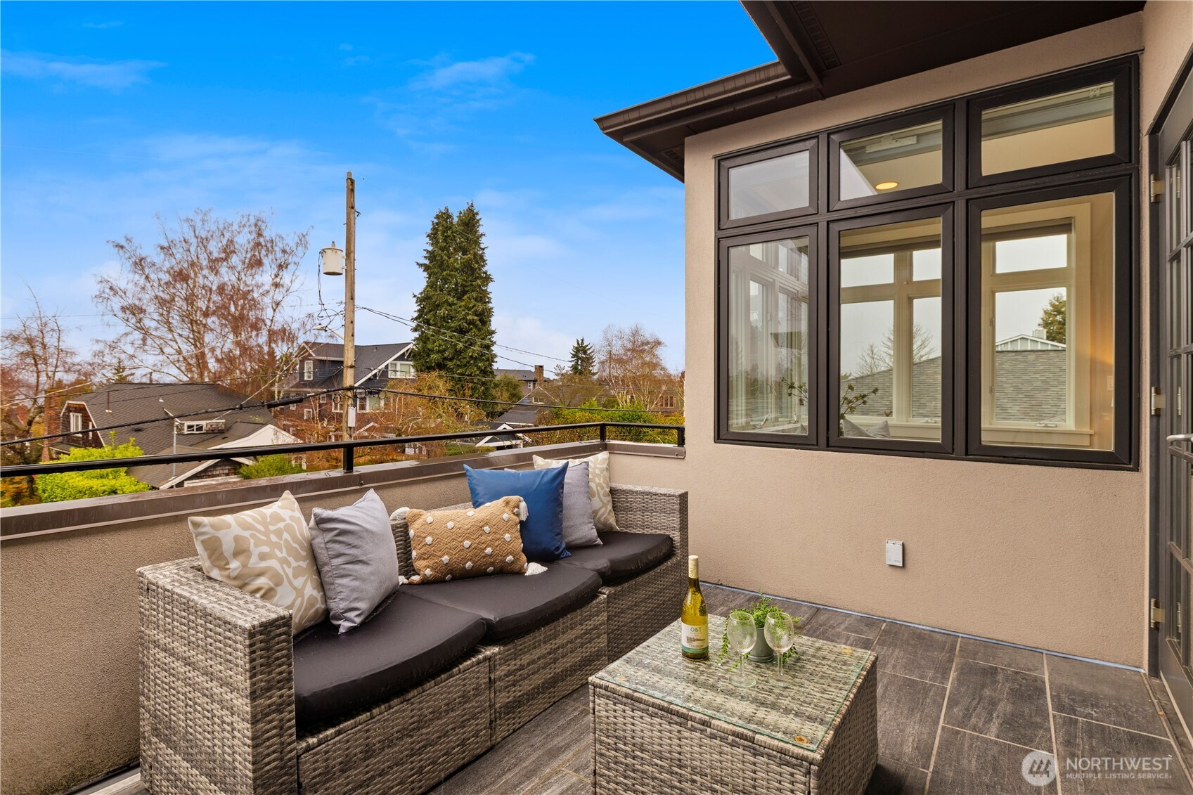 3773 Southwest Grayson Street Seattle, WA 98126 - Photo 31 of 40 a view of a roof deck with couches and sky view