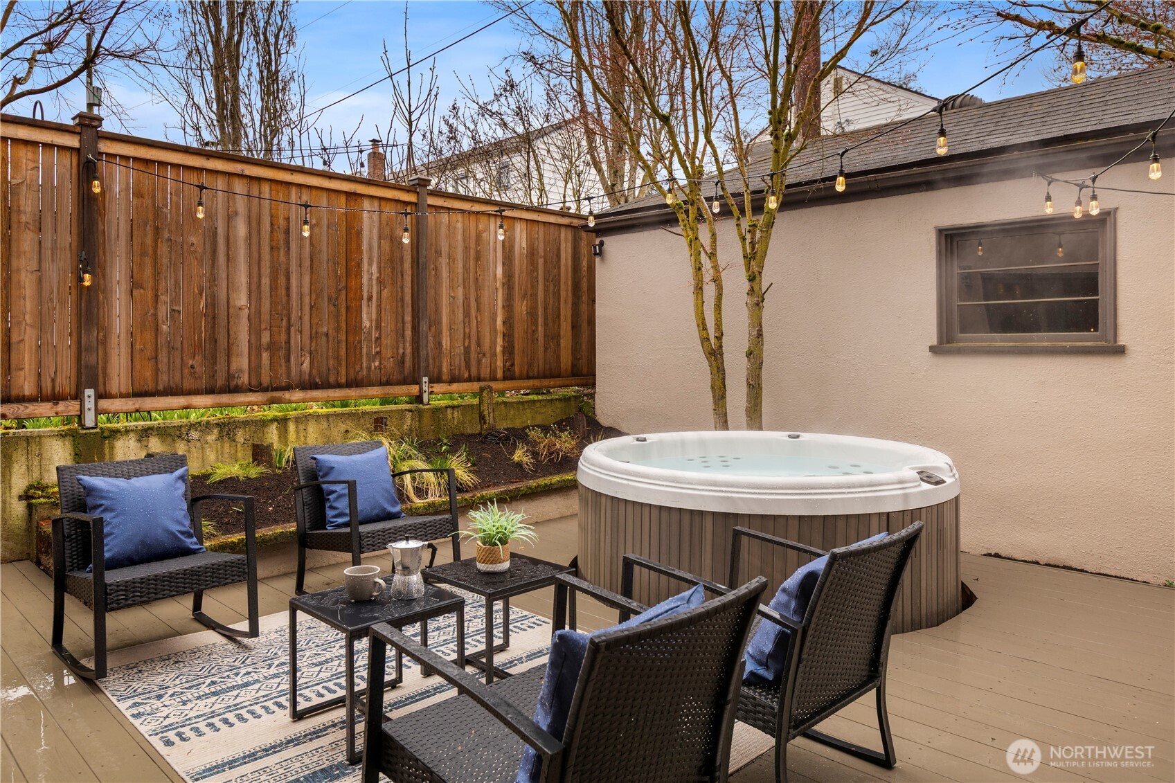 3773 Southwest Grayson Street Seattle, WA 98126 - Photo 36 of 40 a backyard of a house with table and chairs