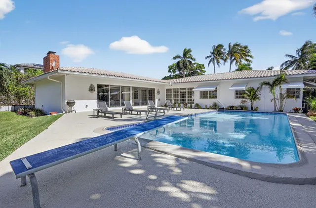 a view of a house with roof deck and sitting area