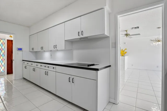 a kitchen with stainless steel appliances granite countertop a sink and a stove top oven