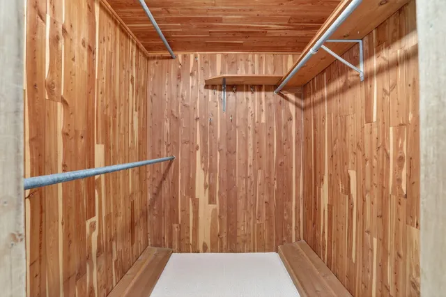 a view of a balcony with wooden walls