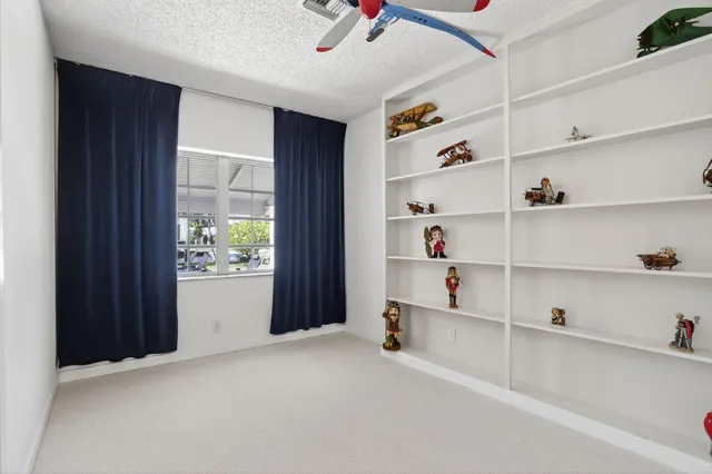 a view of an empty room with shelves