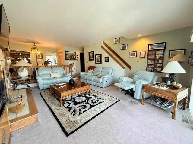 a living room with furniture and a table