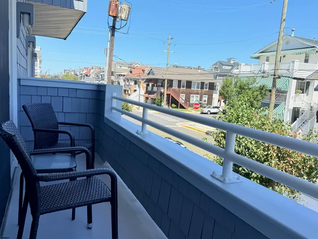 a view of a balcony with chairs