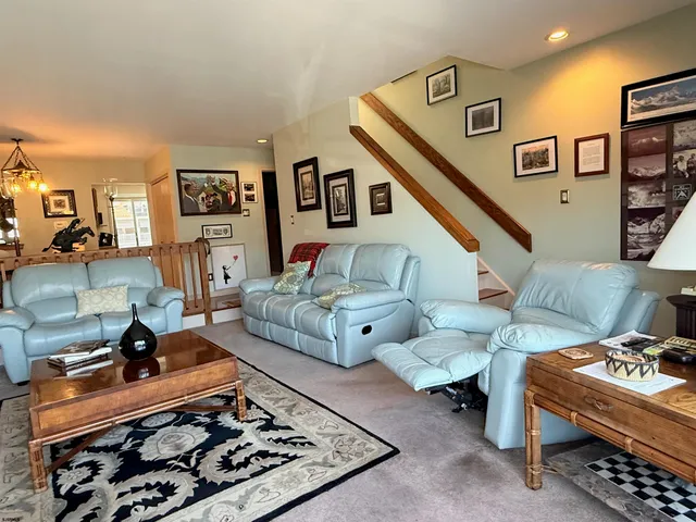 a living room with furniture and a rug