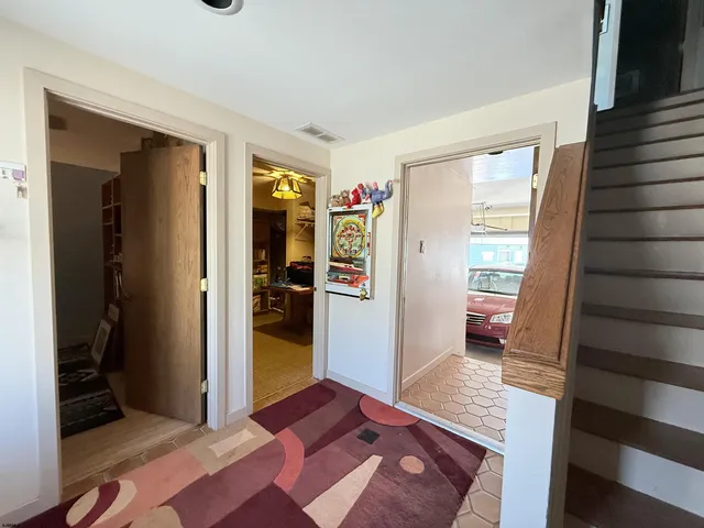 a area with wooden floor and furniture