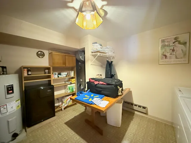 a living room with a couch and a dining table