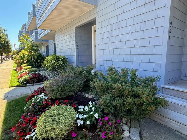 a view of a house with a flower garden