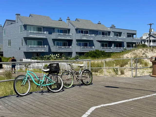 a front view of a house with large pool table and chairs