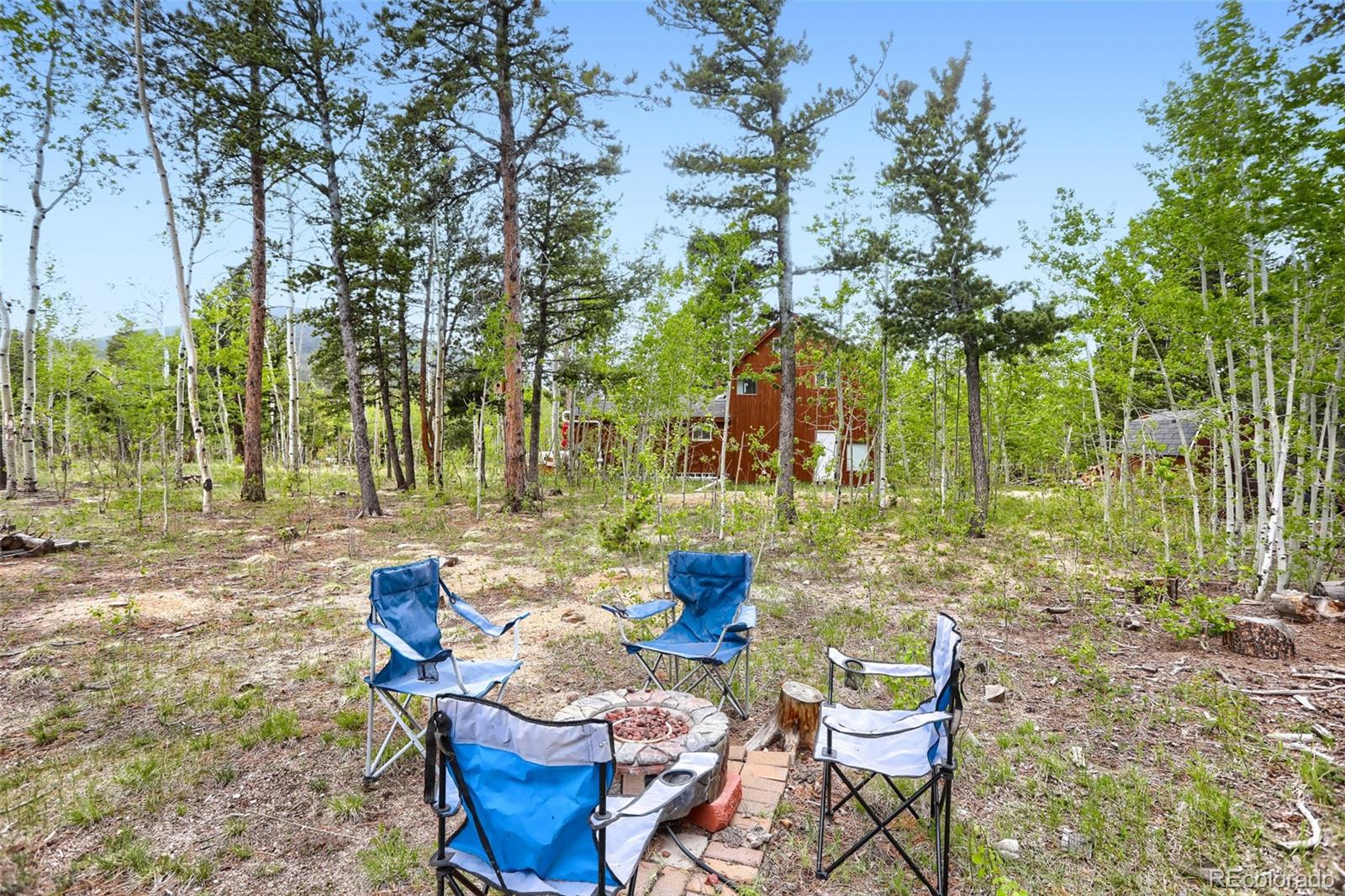 2 Debra Ann Road Golden, CO 80403 - Photo 27 of 41 a view of a chairs and table in the backyard