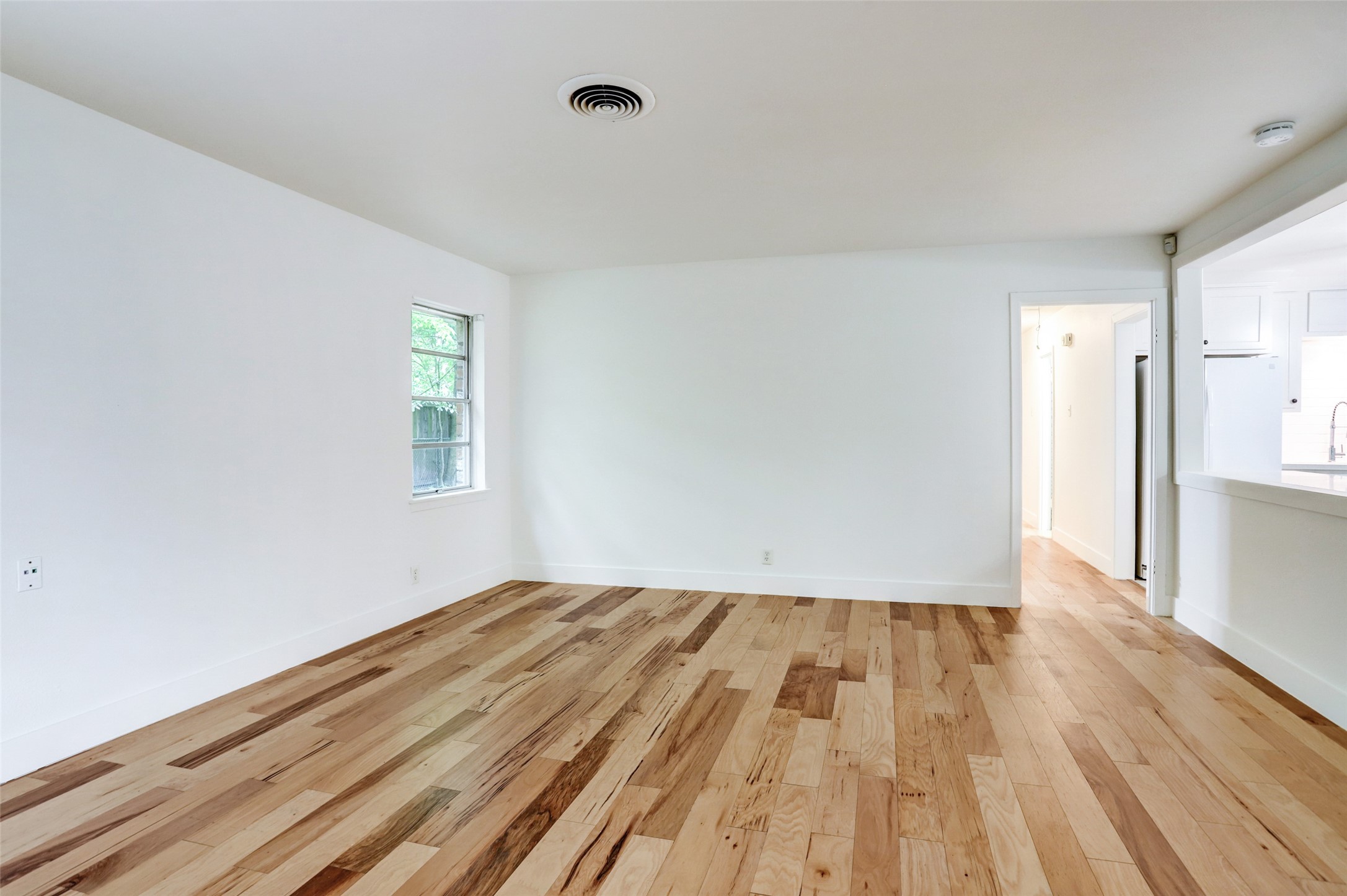3611 Galway Lane Houston, TX 77080 - Photo 7 of 16 a view of room with window and wooden floor