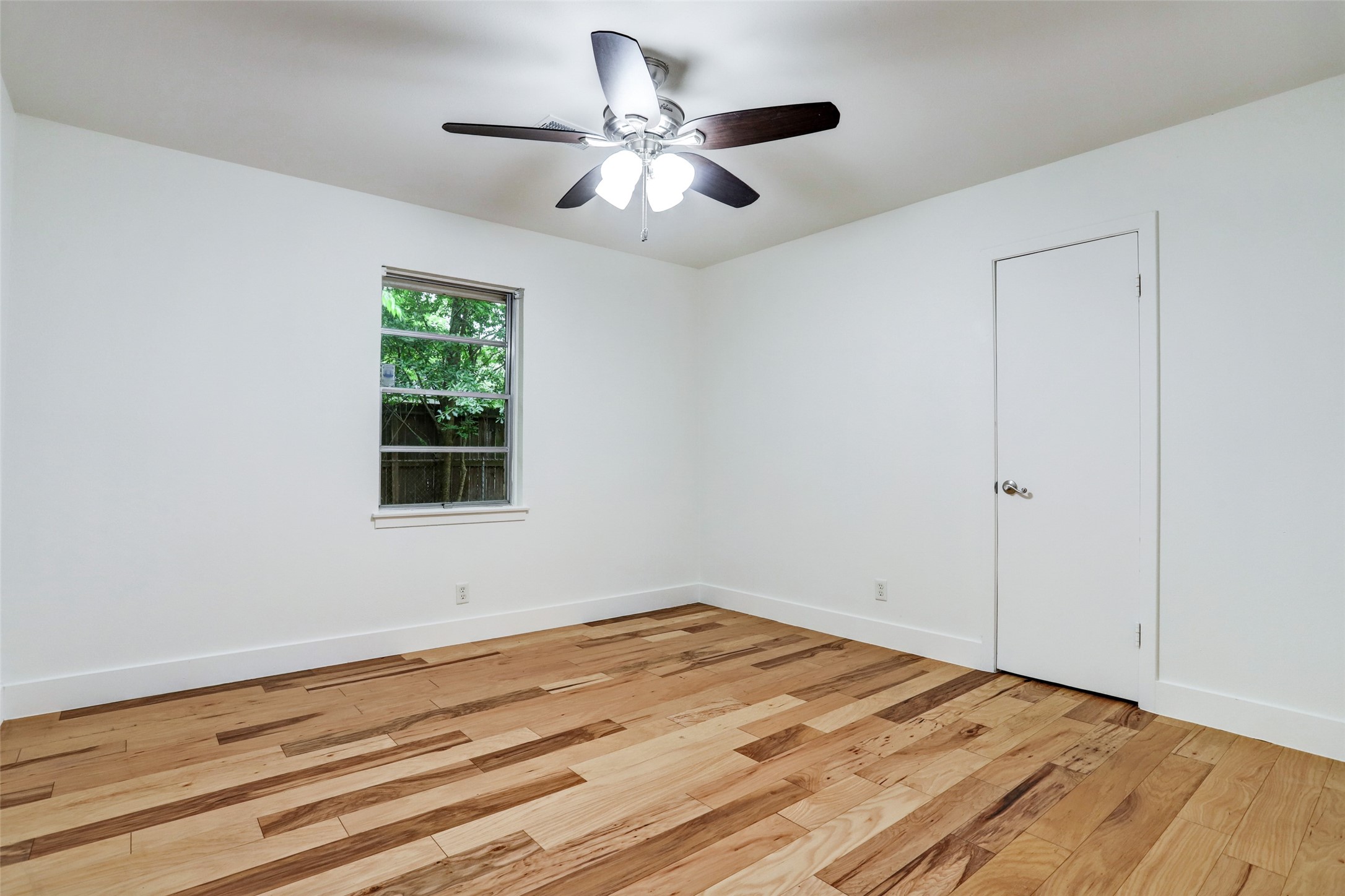 3611 Galway Lane Houston, TX 77080 - Photo 8 of 16 a view of a room with wooden floor and a window