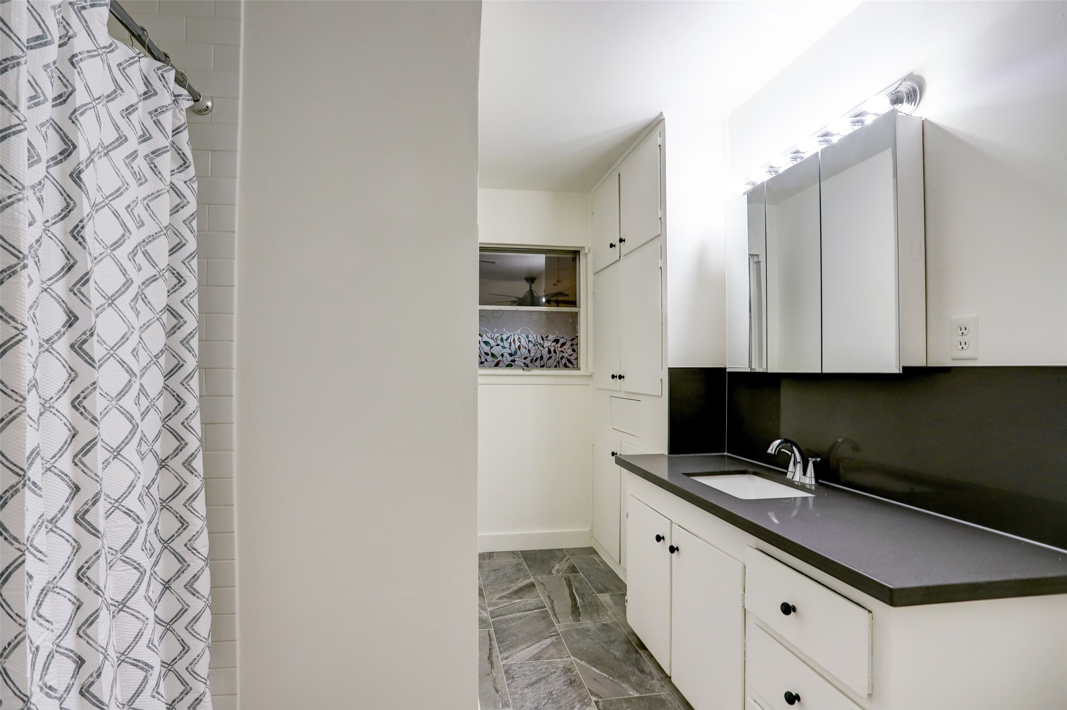3611 Galway Lane Houston, TX 77080 - Photo 10 of 16 a kitchen with granite countertop white cabinets and stainless steel appliances