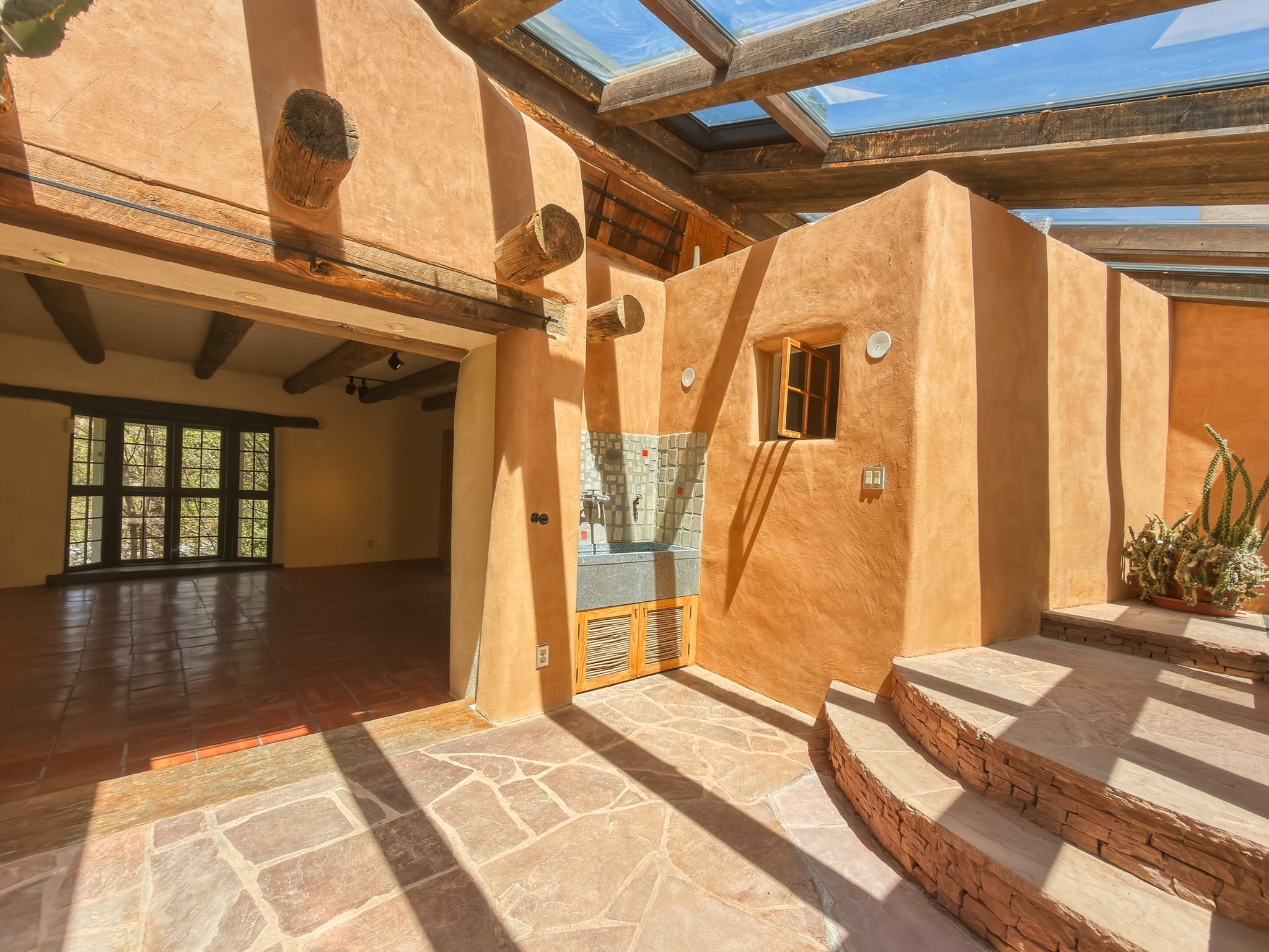 1692 Upper Canyon Road Santa Fe, NM 87501 - Photo 13 of 52 Conservatory view into the Southwestern Great Room.