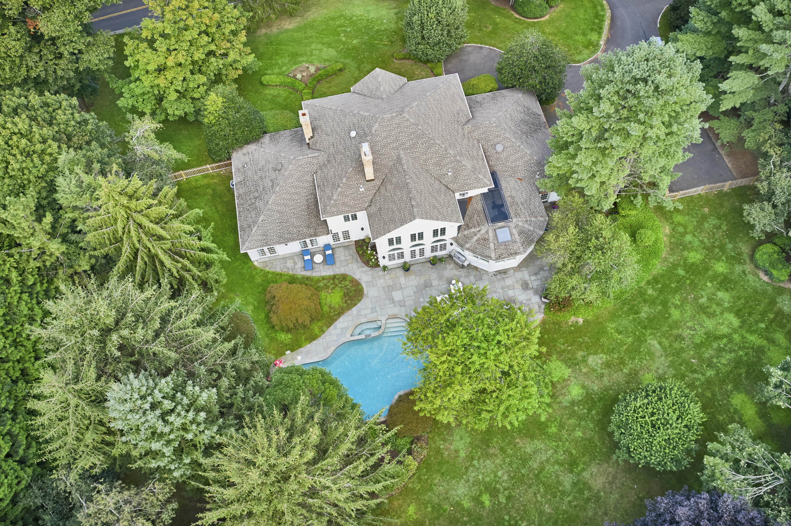 40 Pear Tree Point Road Darien, CT 06820 - Photo 2 of 50 an aerial view of a house with a garden and lake view