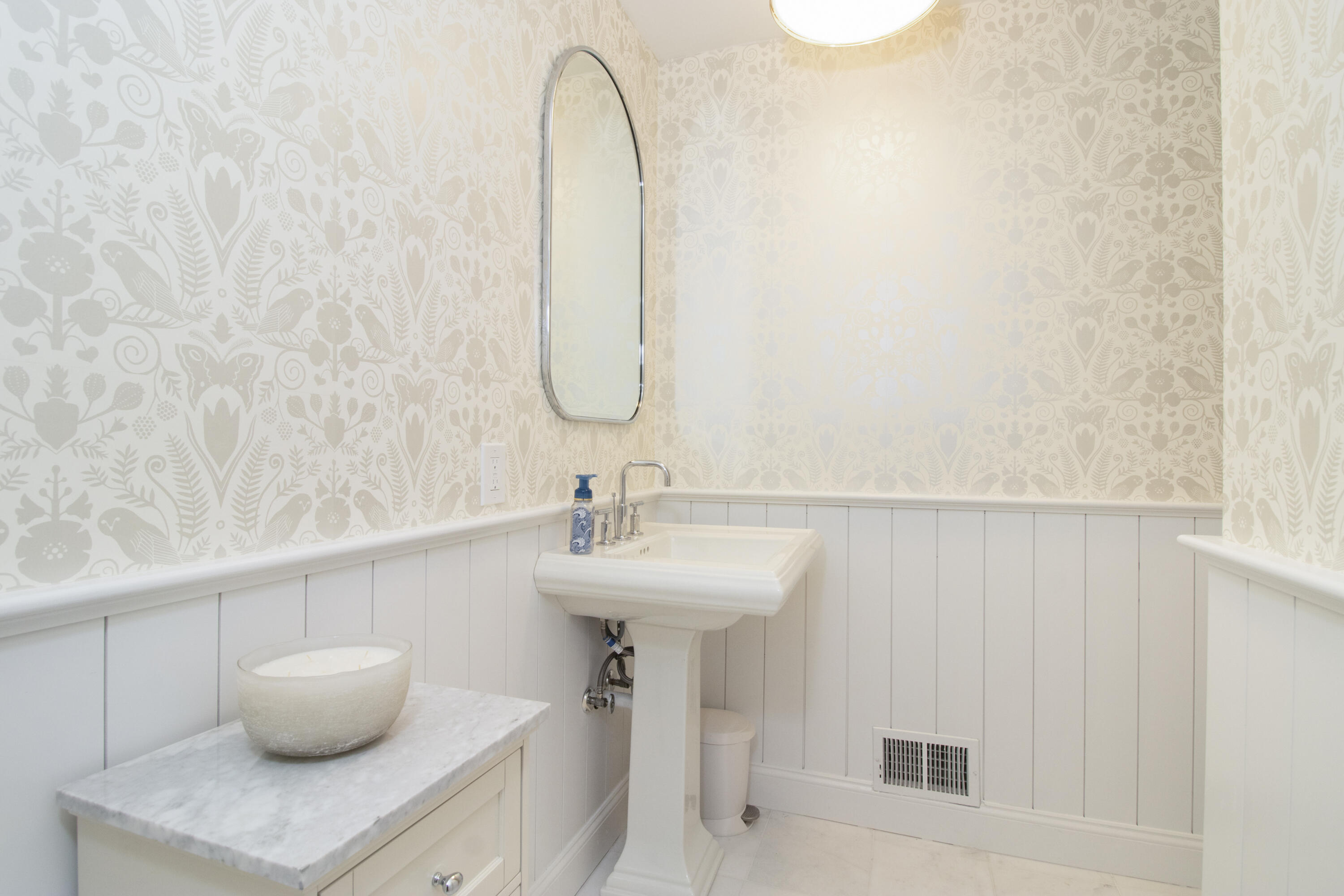 40 Pear Tree Point Road Darien, CT 06820 - Photo 13 of 50 a bathroom with a sink and a mirror