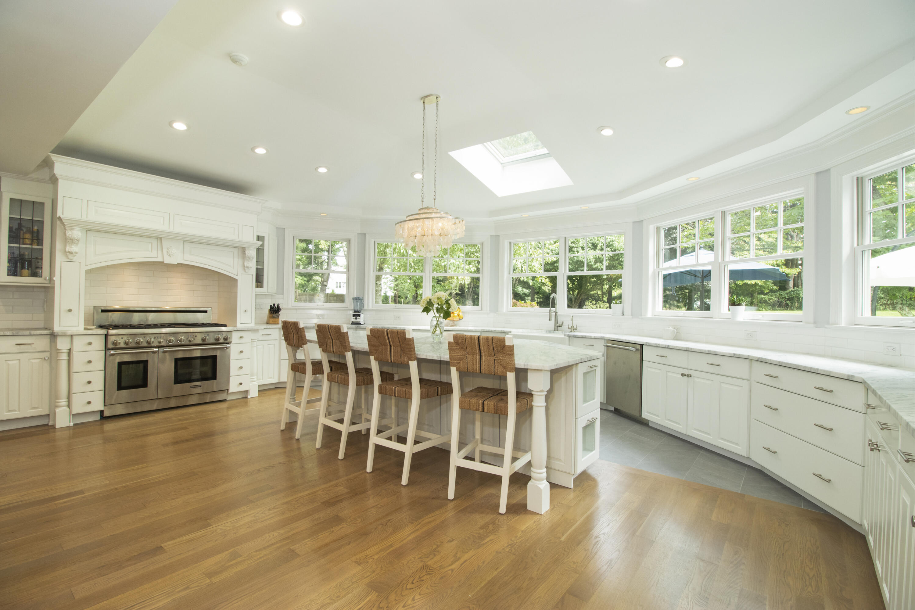 40 Pear Tree Point Road Darien, CT 06820 - Photo 14 of 50 a large kitchen with a table and chairs
