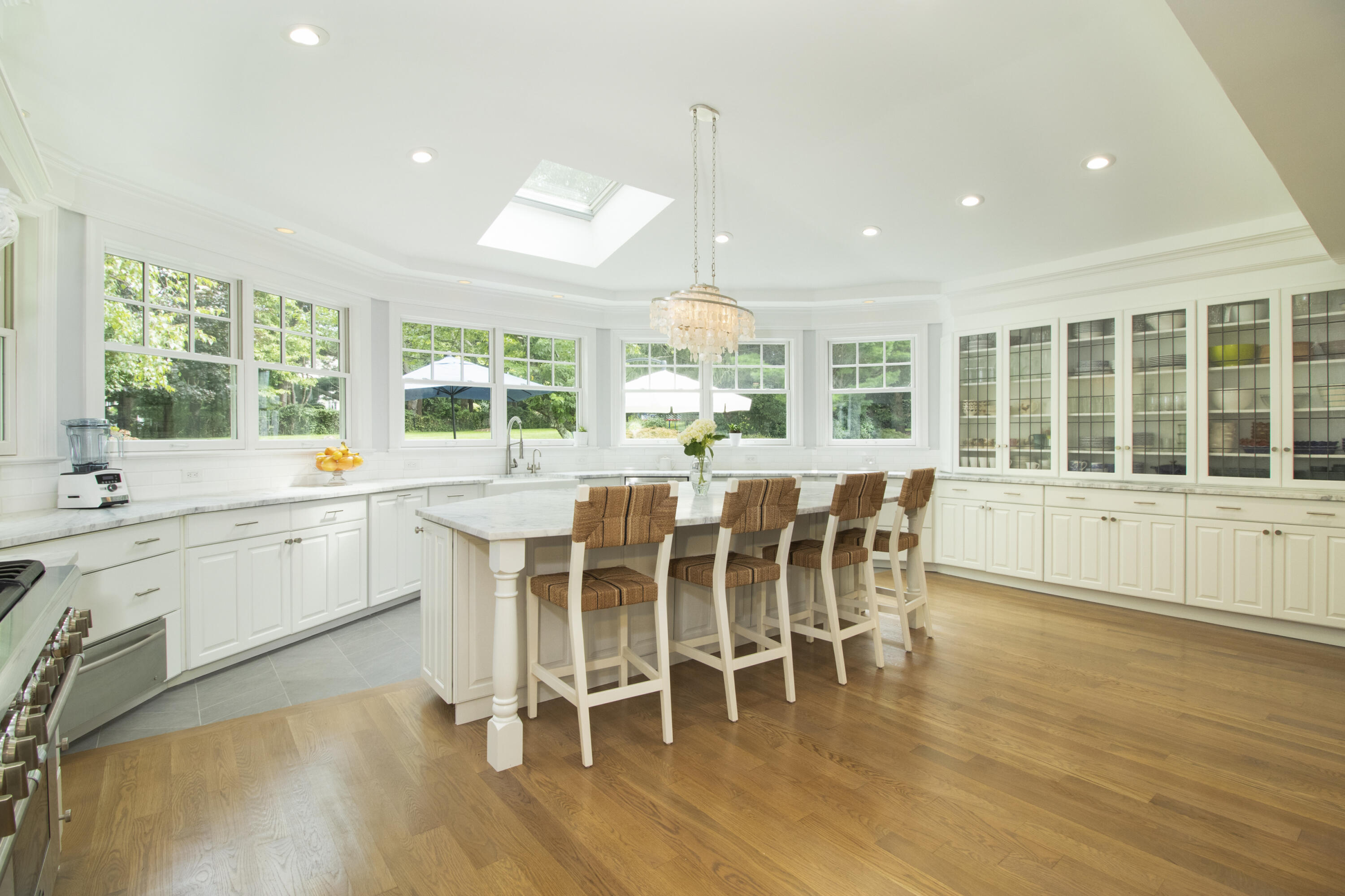 40 Pear Tree Point Road Darien, CT 06820 - Photo 15 of 50 a large dining space with furniture window and wooden floor
