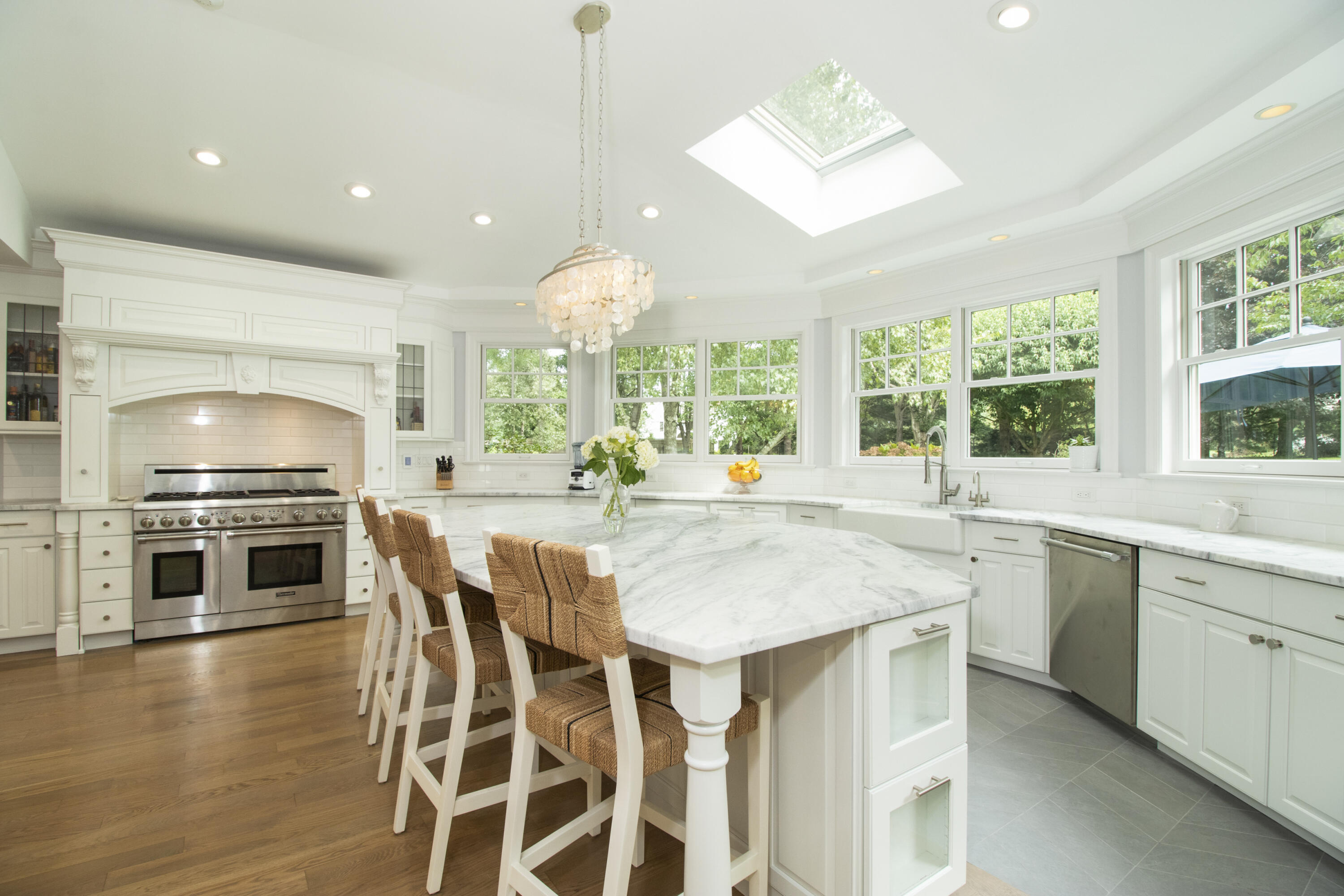 40 Pear Tree Point Road Darien, CT 06820 - Photo 16 of 50 a kitchen with stainless steel appliances granite countertop a stove and a wooden floors