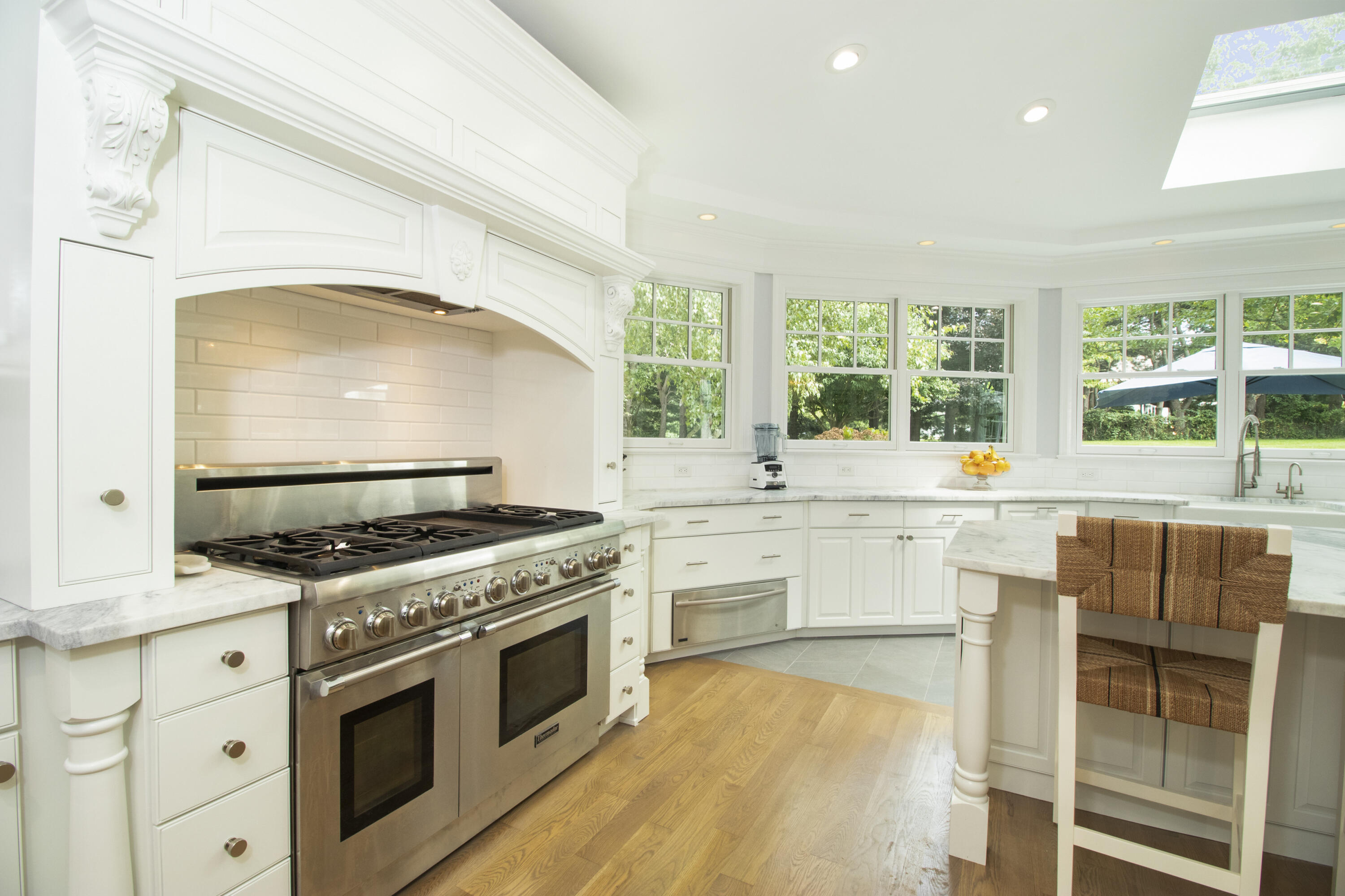 40 Pear Tree Point Road Darien, CT 06820 - Photo 17 of 50 a kitchen with a stove a sink and a refrigerator