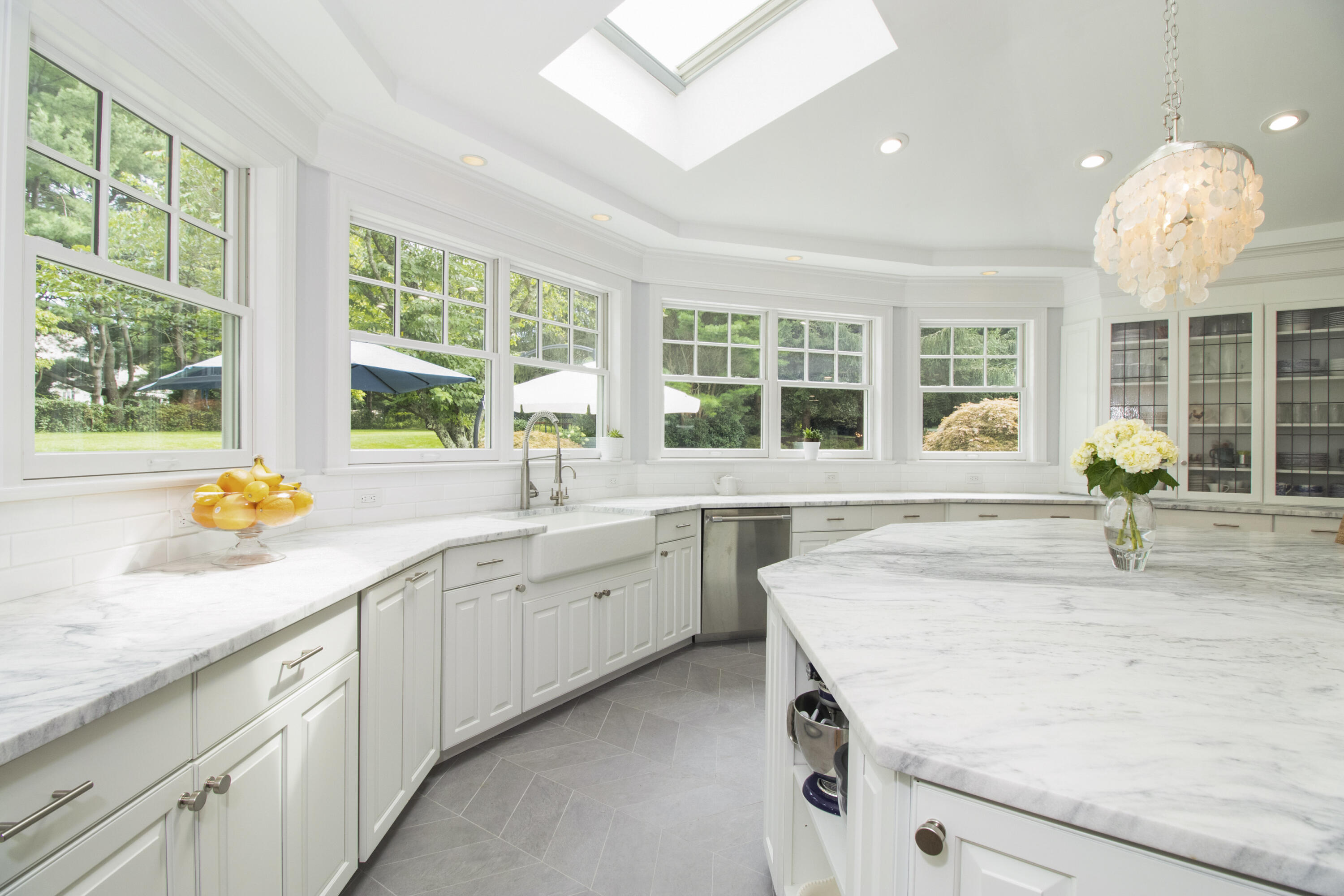 40 Pear Tree Point Road Darien, CT 06820 - Photo 18 of 50 a kitchen with granite countertop sink and window