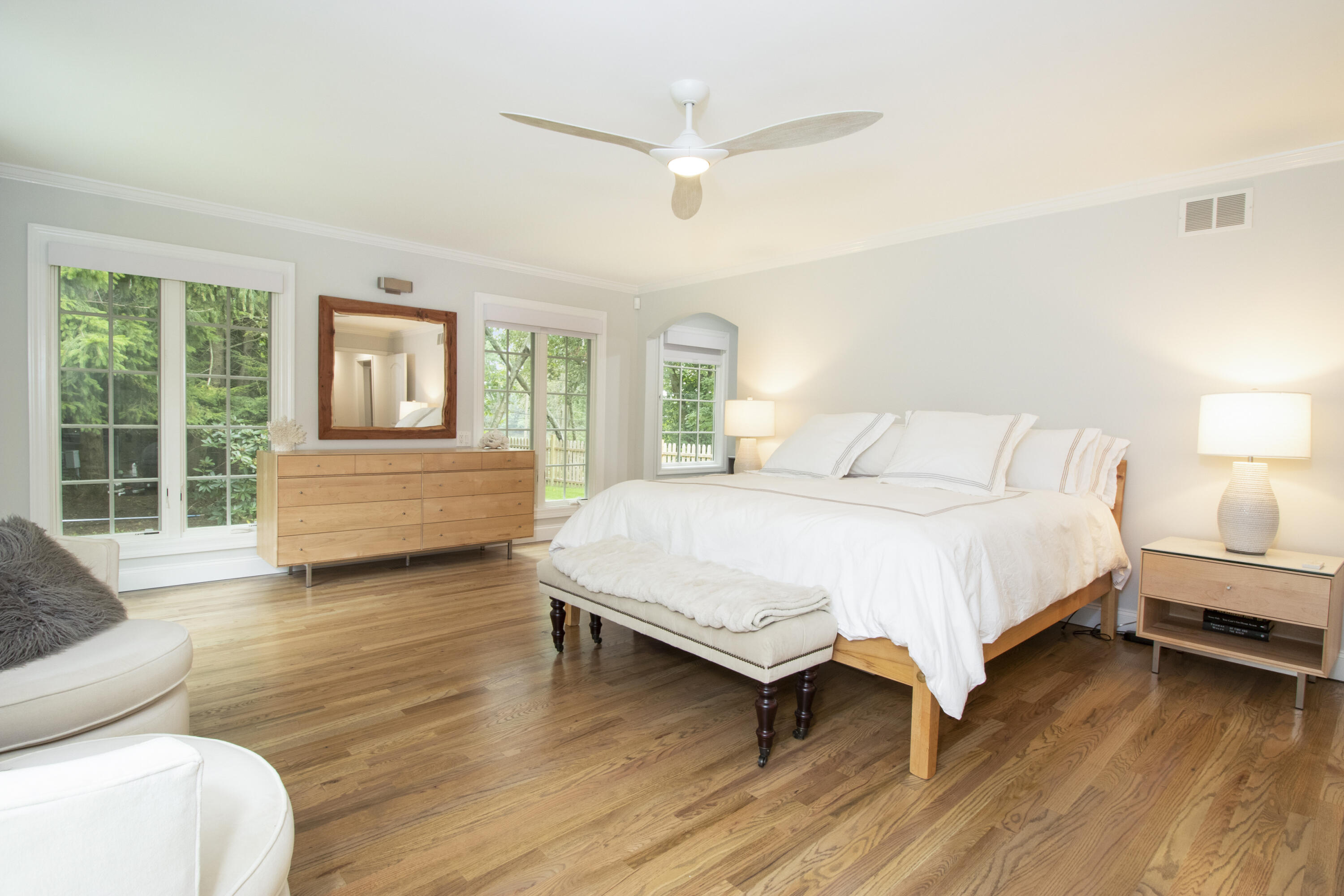 40 Pear Tree Point Road Darien, CT 06820 - Photo 30 of 50 a spacious bedroom with a bed and a large window