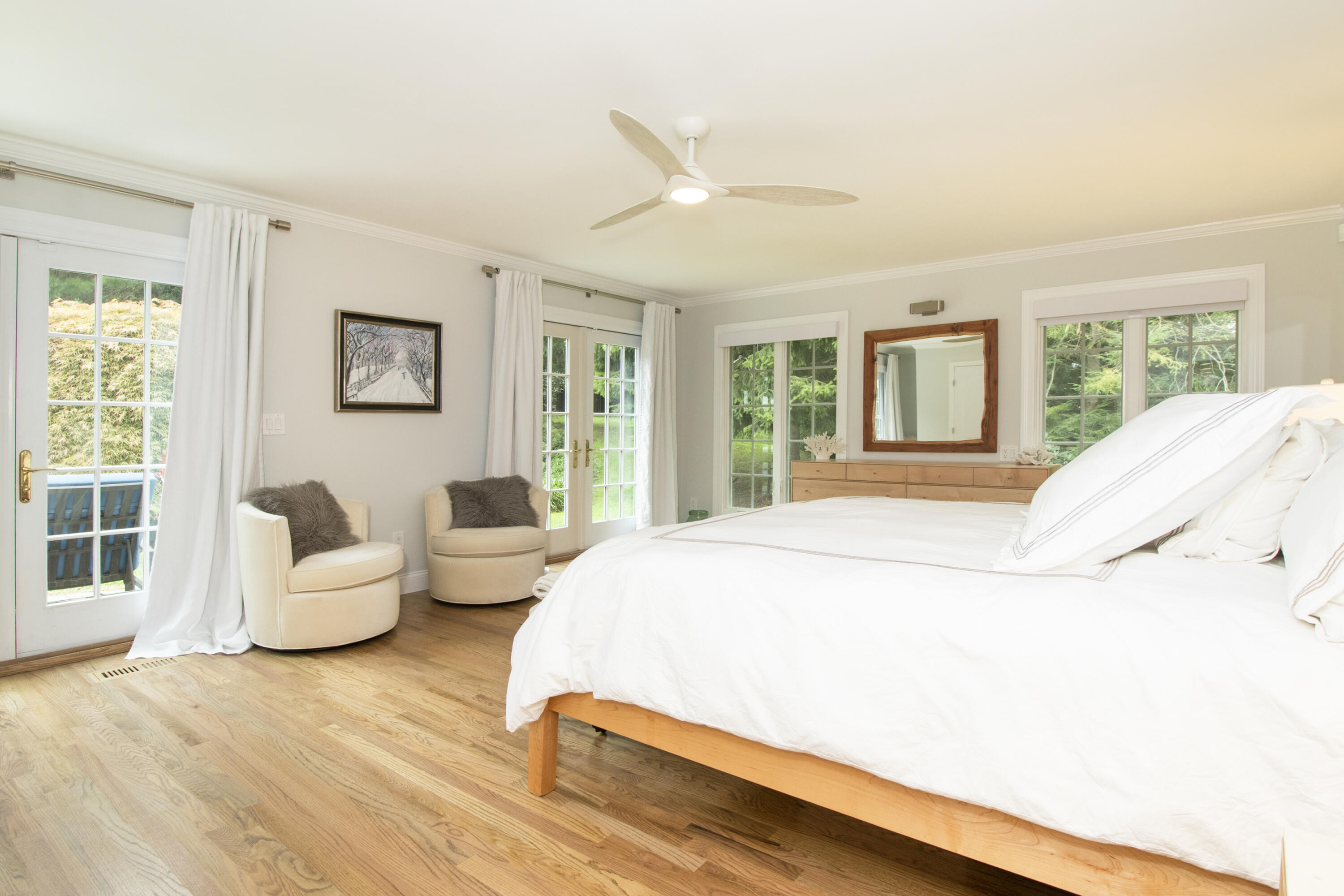 40 Pear Tree Point Road Darien, CT 06820 - Photo 31 of 50 a spacious bedroom with a bed and large windows