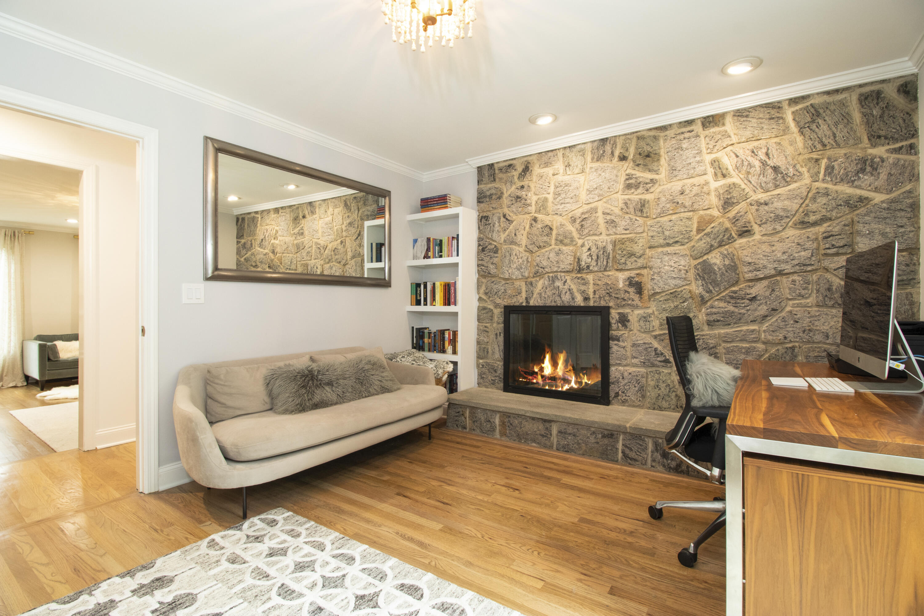 40 Pear Tree Point Road Darien, CT 06820 - Photo 32 of 50 a living room with furniture and a fireplace