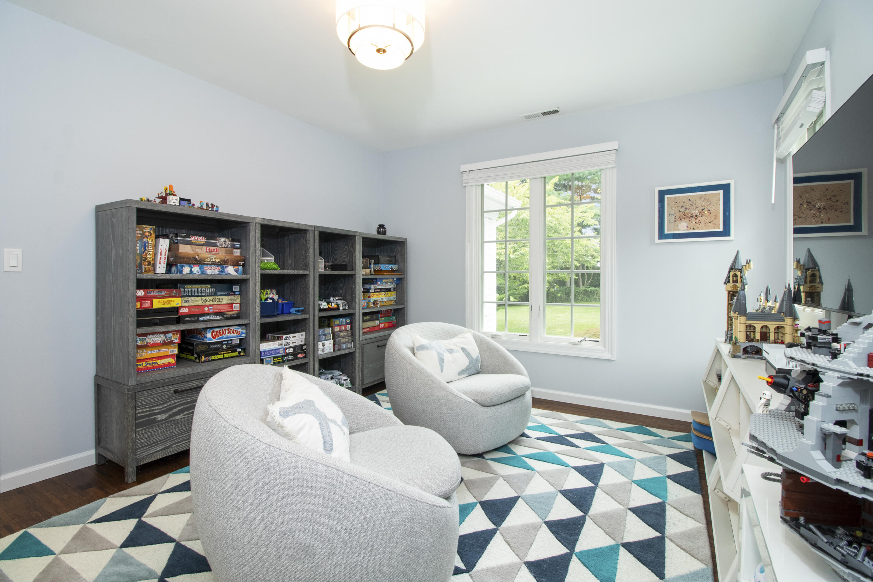 40 Pear Tree Point Road Darien, CT 06820 - Photo 41 of 50 a living room with furniture and a flat screen tv