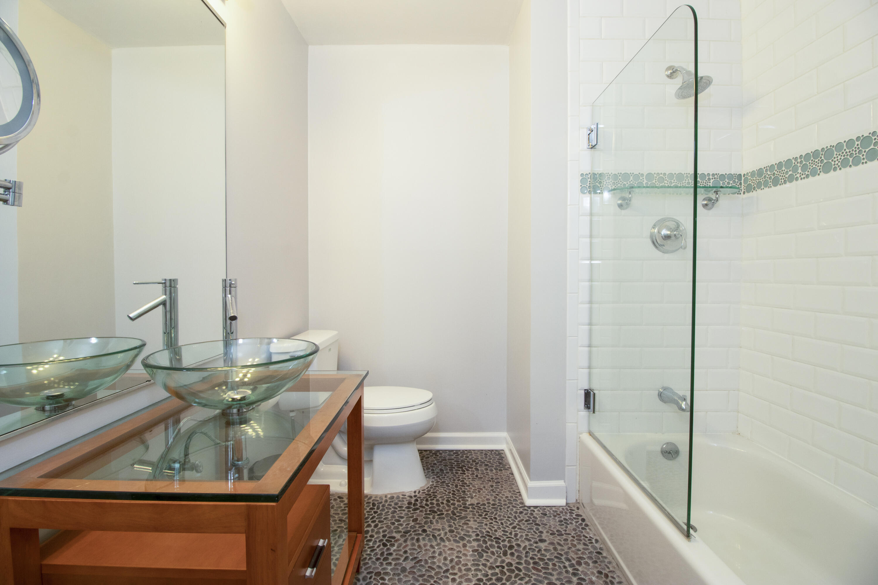 40 Pear Tree Point Road Darien, CT 06820 - Photo 42 of 50 a bathroom with a granite countertop sink a toilet and shower