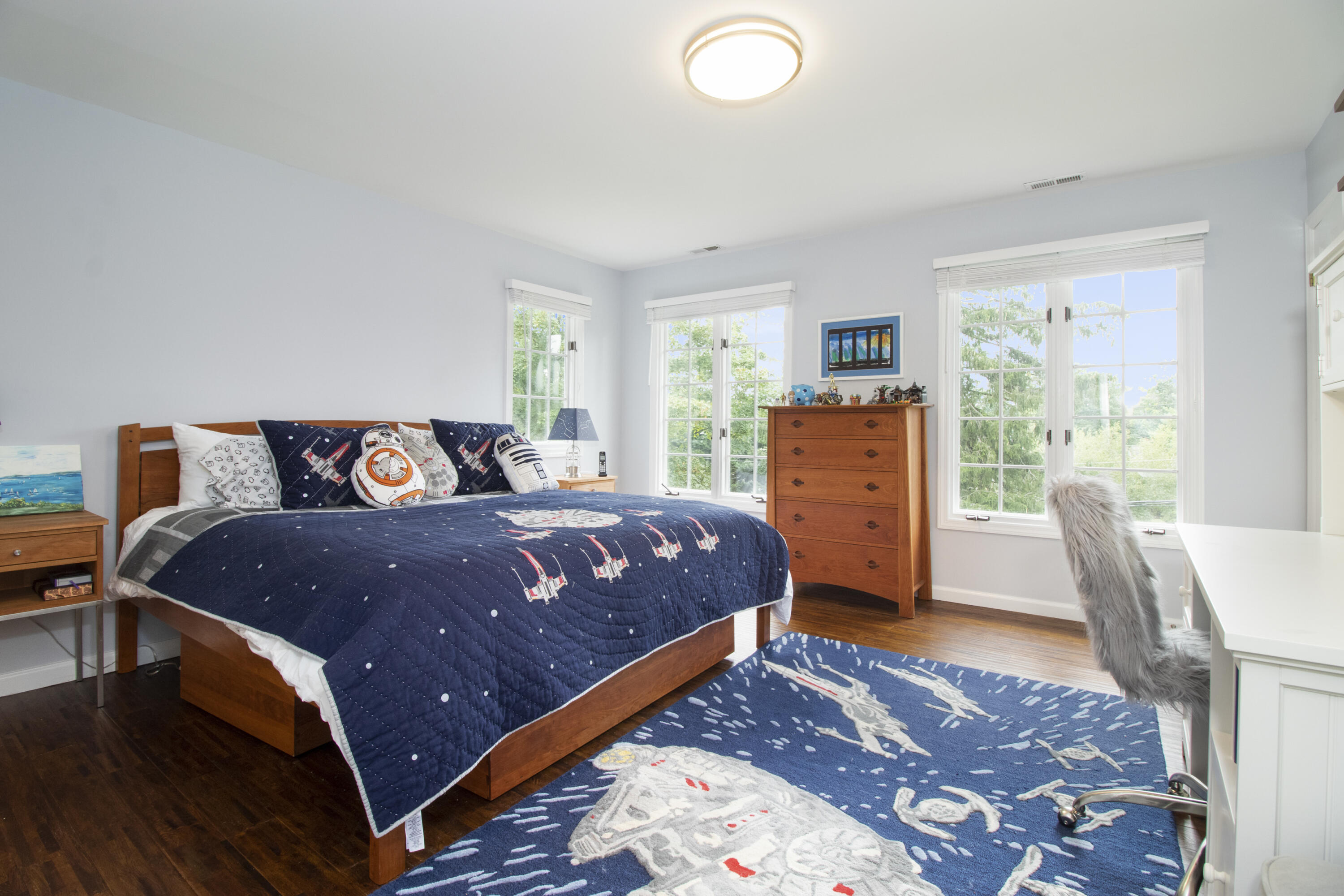 40 Pear Tree Point Road Darien, CT 06820 - Photo 43 of 50 a bedroom with a bed and wooden floor