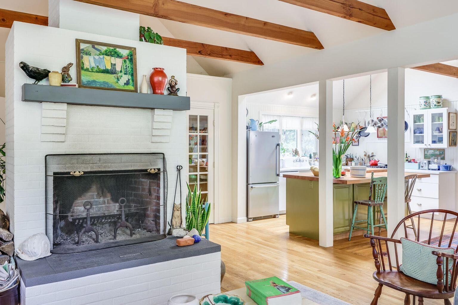 660 Hay Road Eastham, MA 02642 - Photo 10 of 48 a living room with furniture and a fireplace
